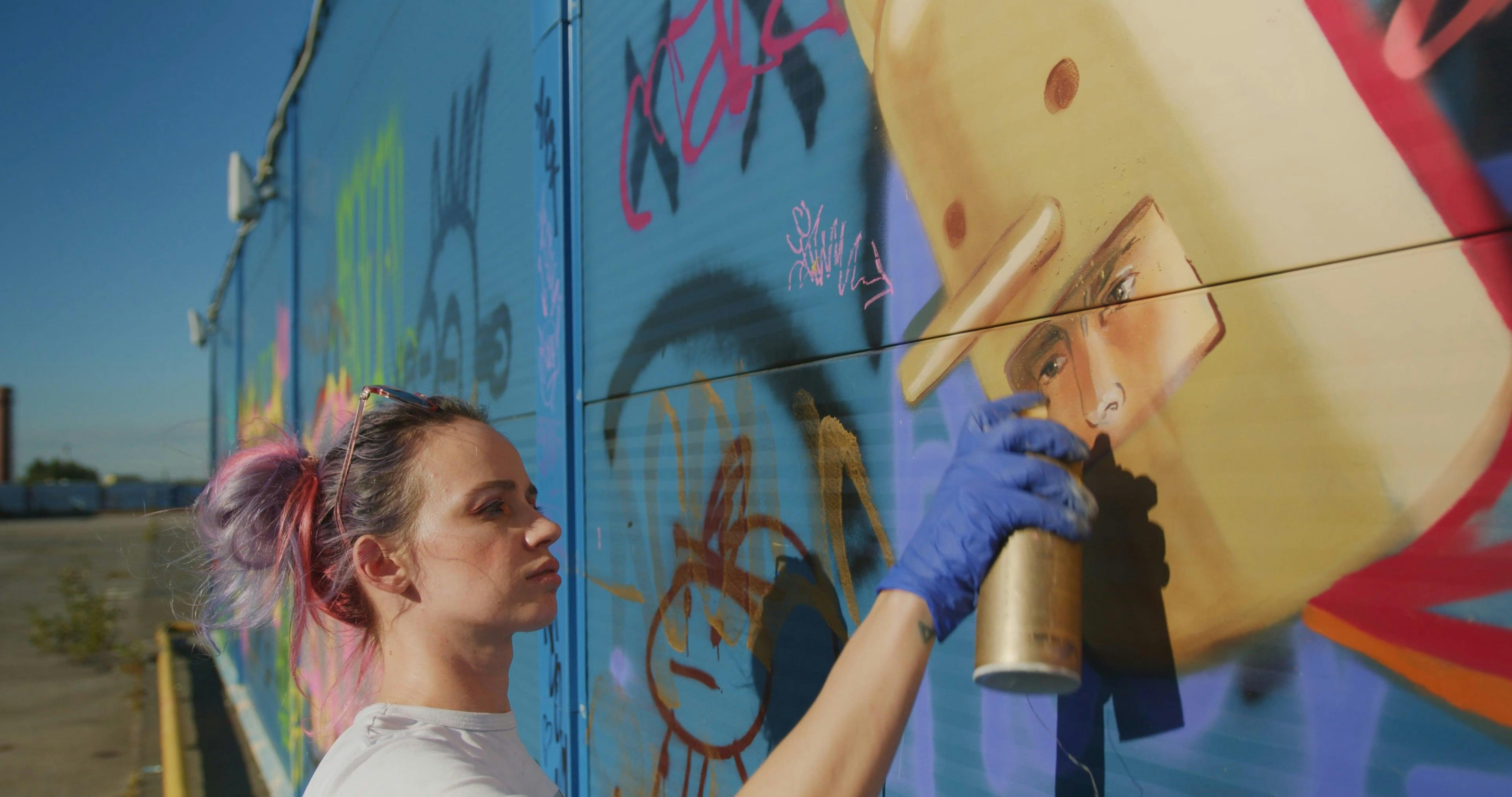 Video of a Woman Using Spray Can in Painting · Free Stock Video