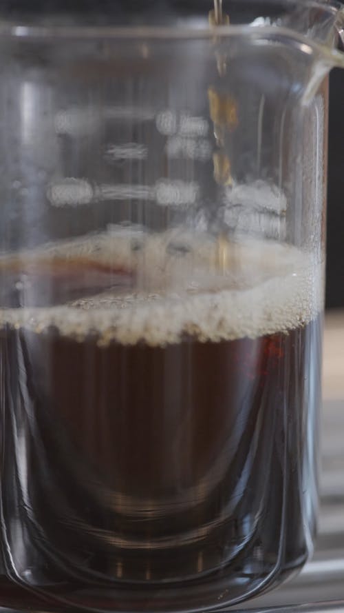 Black Coffee Dripping in a Glass Pitcher
