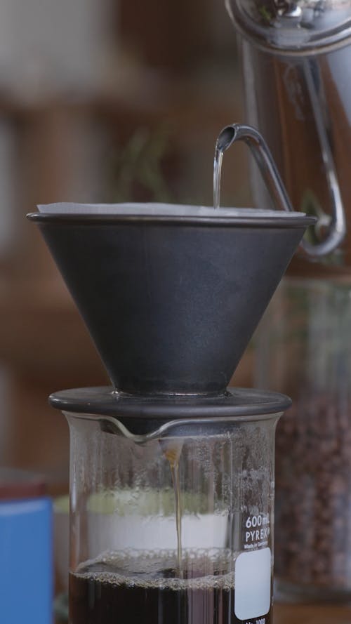 Person Making Drip Coffee