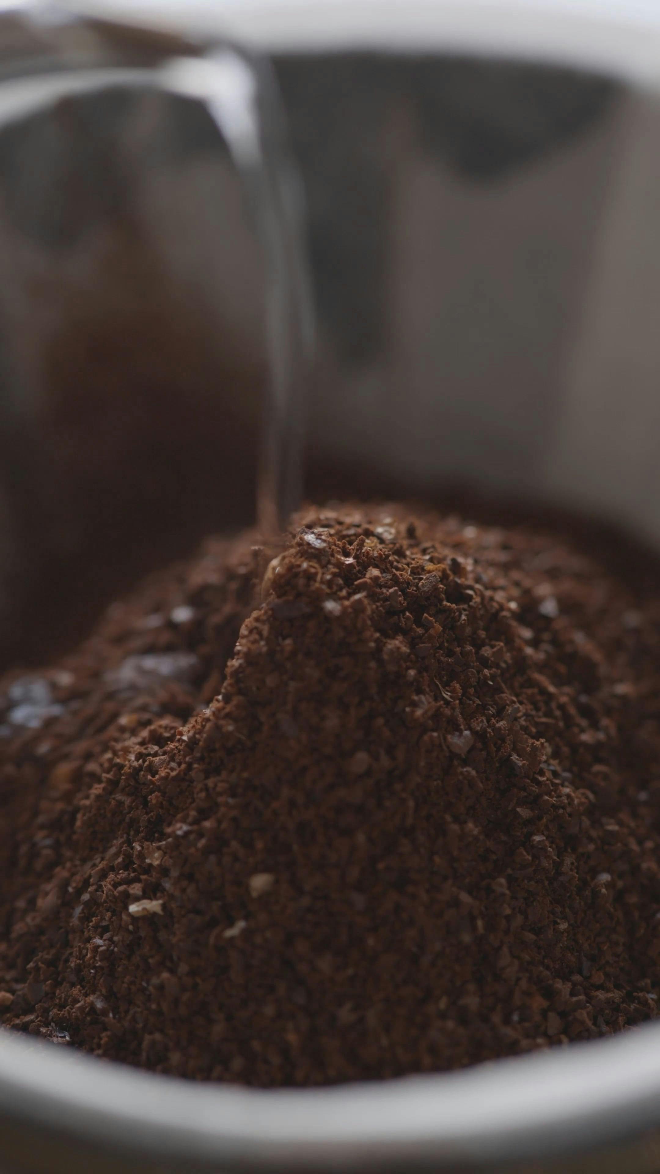 Person Pouring Water on Ground Coffee · Free Stock Video