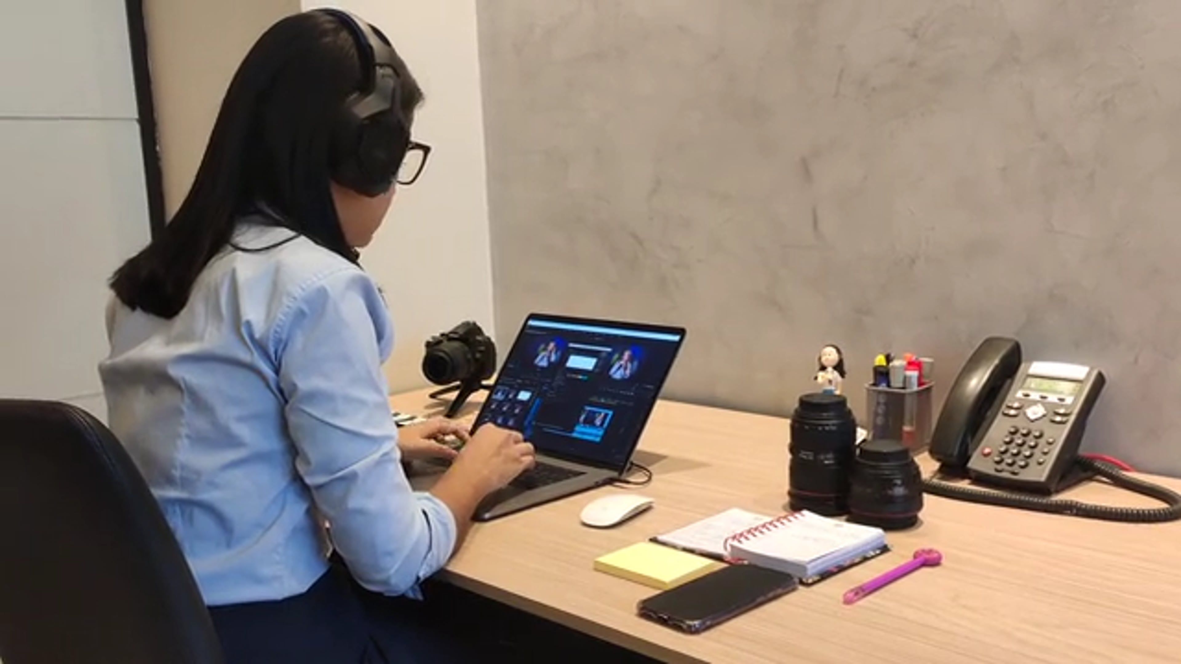 A Woman Wearing Headset While Typing on a Laptop Free Stock Video ...