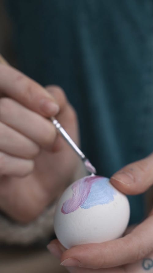 Video of a Person Painting an Egg