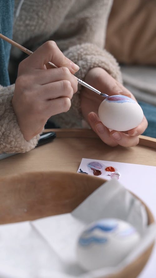 Video of a Person Decorating an Egg