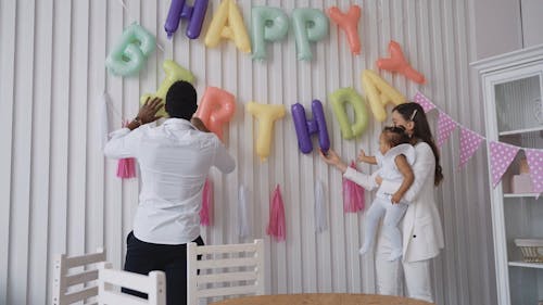 Video of a Family Decorating for a Birthday