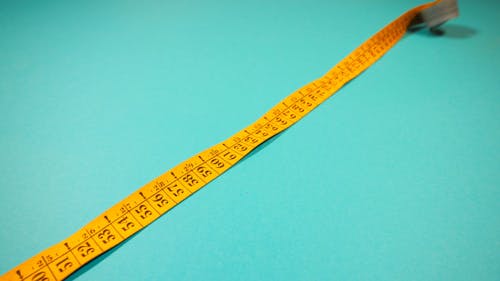 A Tape Measure on a Blue Table 