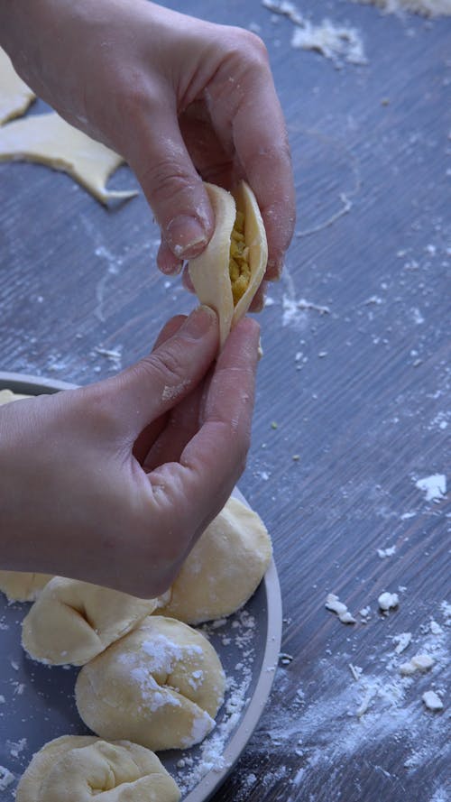 A Person Wrapping a Dumpling