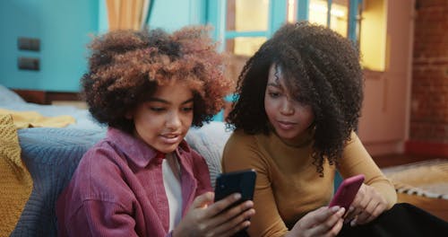 Girls Looking at Mobile Phone Screen