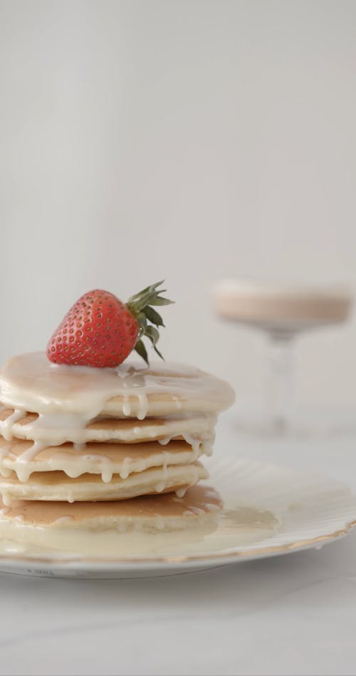 Slicing the Pancakes with Strawberry on Top