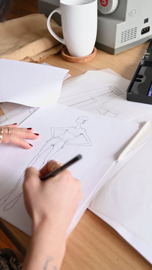 A Person Sketching a Design