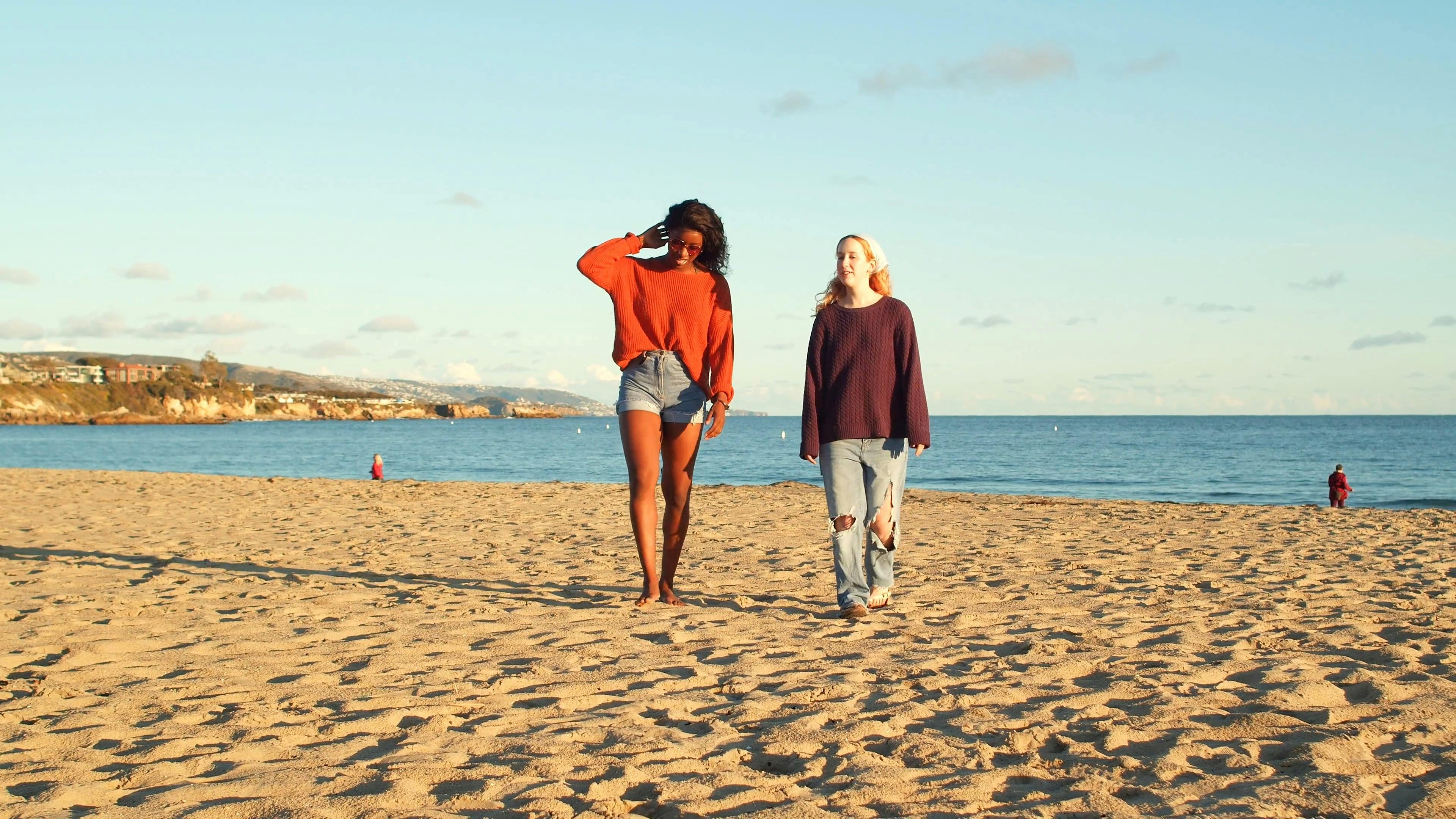Two Women Walking on Beach Sand · Free Stock Video