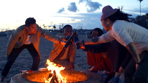 Group of Friends Clinking Beer Bottles