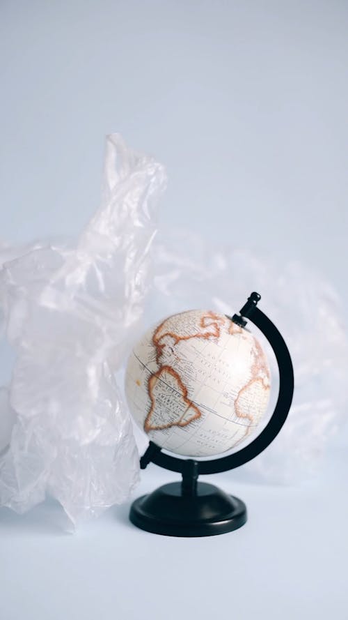 Throwing Clear Plastic Bags on a Globe Stand