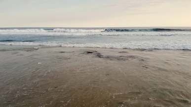 close up video of waves splashing to the shore