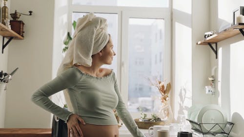 A Pregnant Woman Drinking Coffee