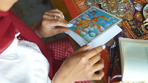 A Woman Holding A Persian New Year Greeting Card