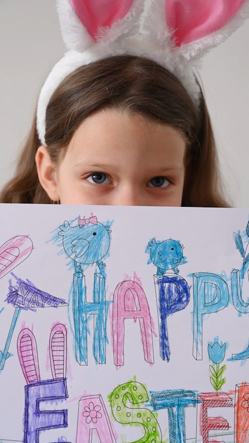 Girl Holding her Easter Drawing