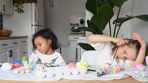 Little Girls Painting Eggs