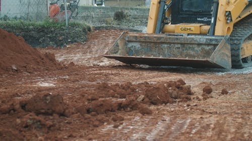 Bulldozer Spreading Soil