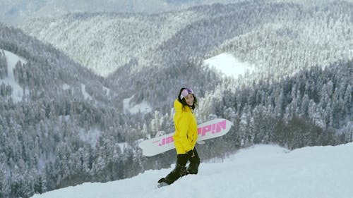 Woman Carrying Her Snowboard