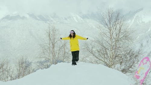 Woman Spinning and Running on Snow