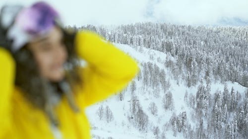 A Beautiful Woman Laughing with Snow on Her Hair 