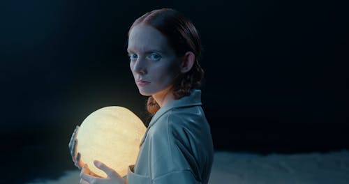 A Woman Walking In The Moon In A Conceptual Video