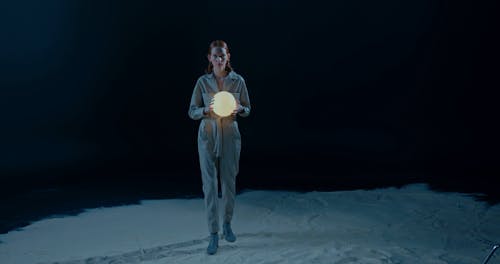 A Woman Walking In The Moon In A Conceptual Video