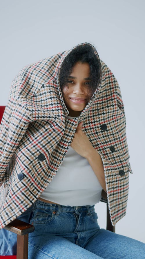 Child Hiding Inside Her Mother's Coat