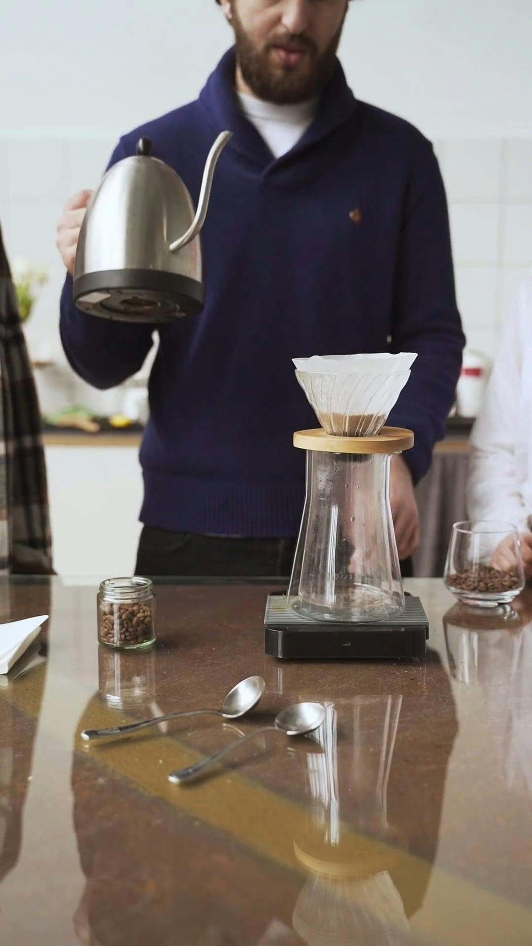 Pouring Hot Water On A Filter Filled With Ground Coffee To Make Brewed