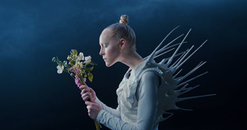 A Female Alien Eating Flowers