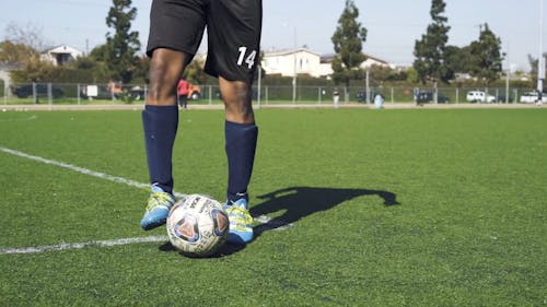 Man Training on a Soccer Field