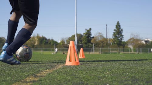 Man Playing Soccer on a Soccer Field