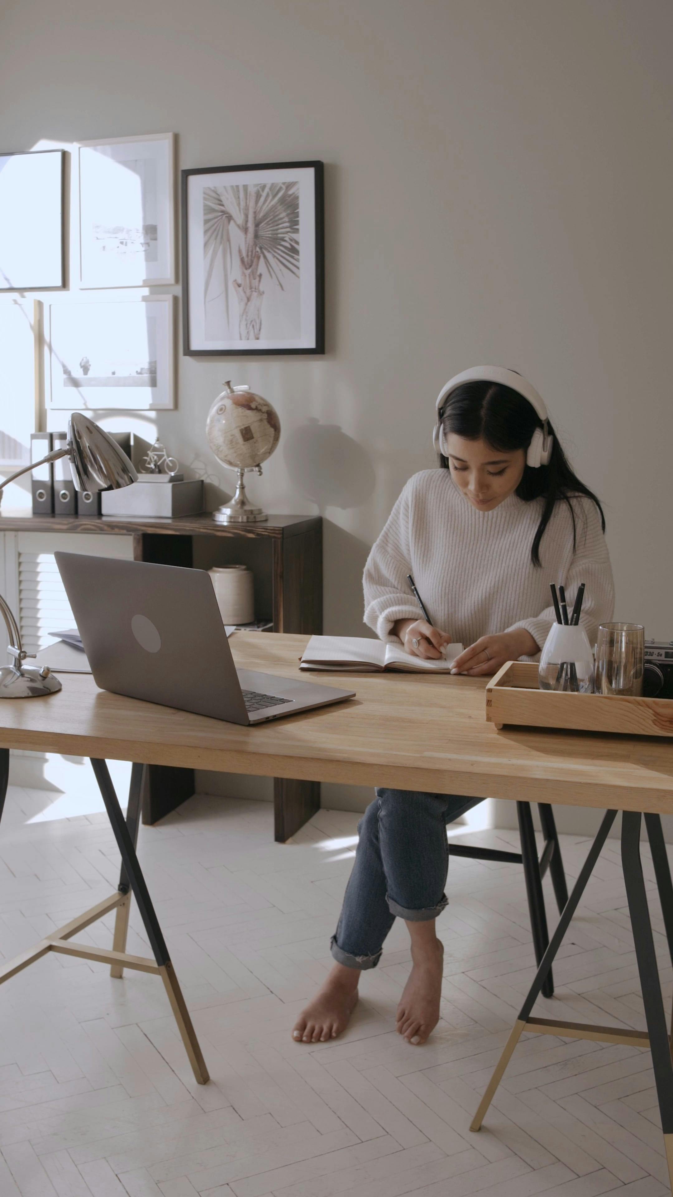 Woman Writing while Looking on the Laptop Free Stock Video Footage
