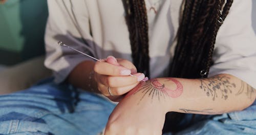 Putting Tattoo on a Hand