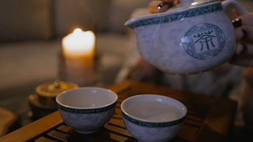 Pouring Hot Water From A Tea Pot