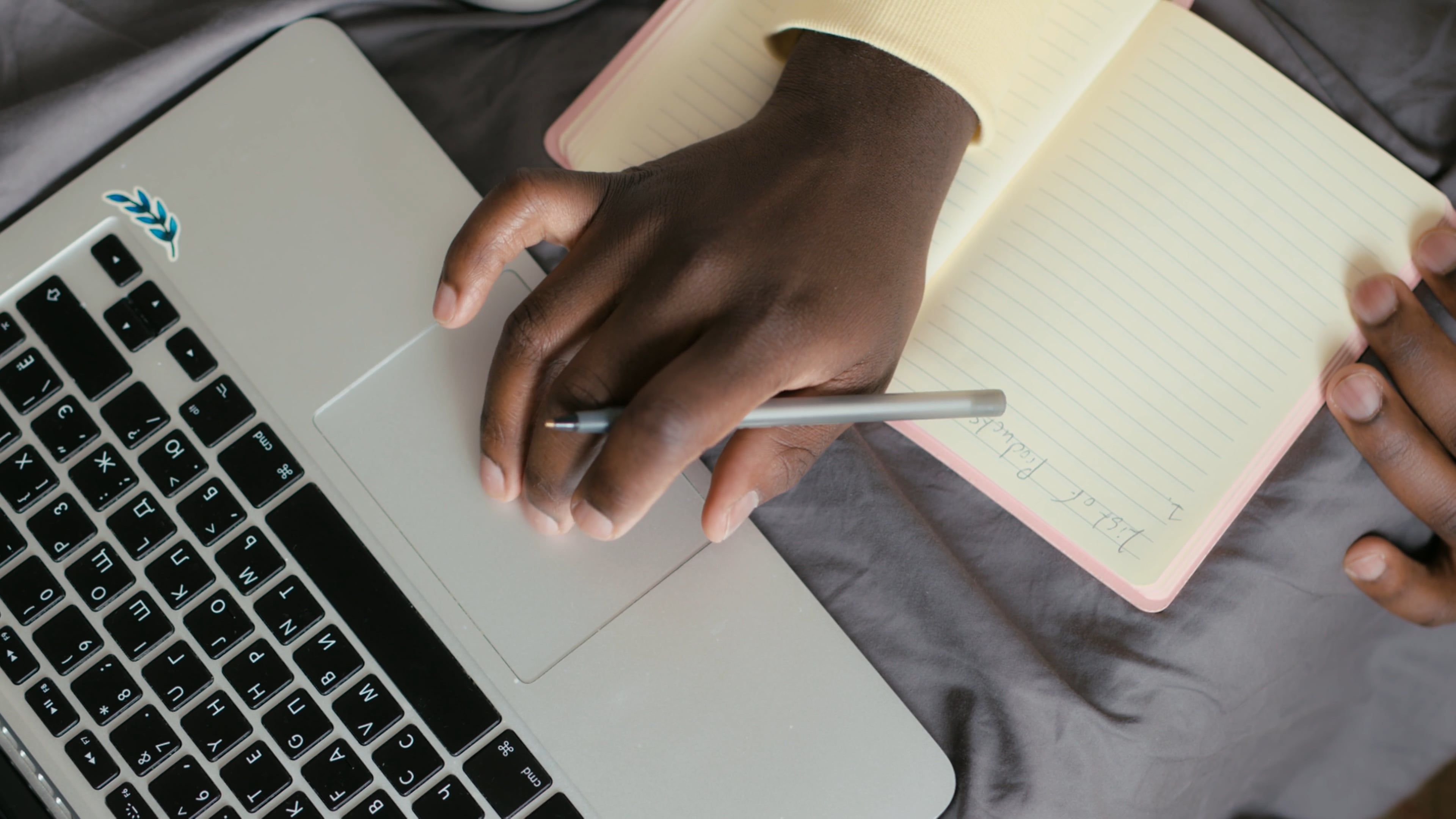 Woman Writing on a Notebook · Free Stock Video