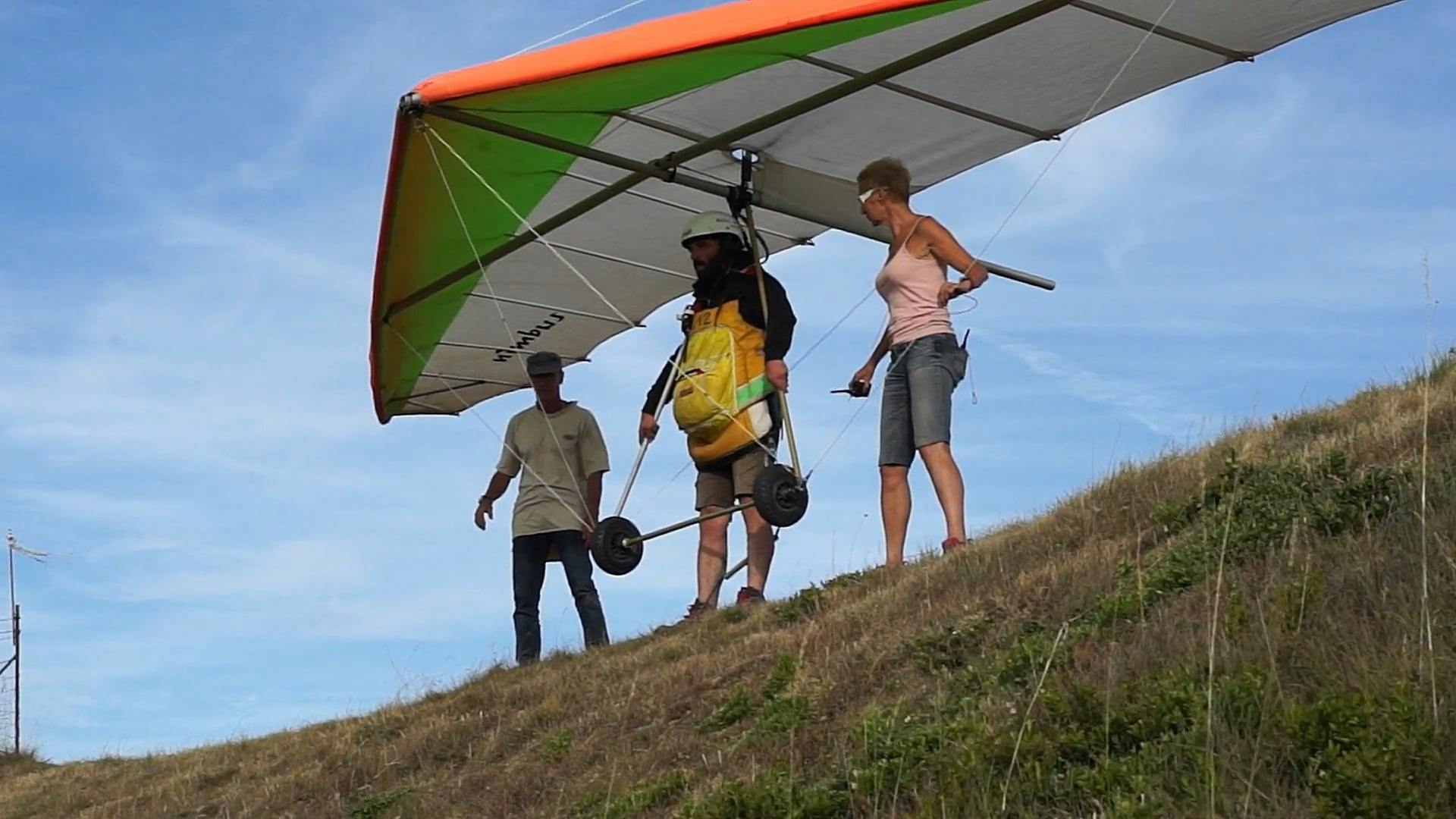 A paraglider is flying over a mountain Free Stock Video Footage