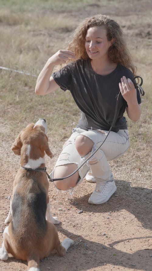 A Woman Training Her Dog