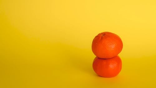 Close Up Video of a Person Getting an Orange