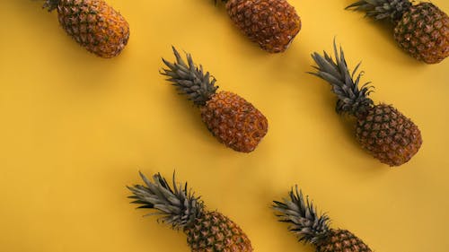 Pineapples in Yelow Background