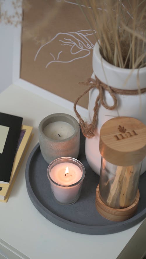 Candles And Books On A Side Table