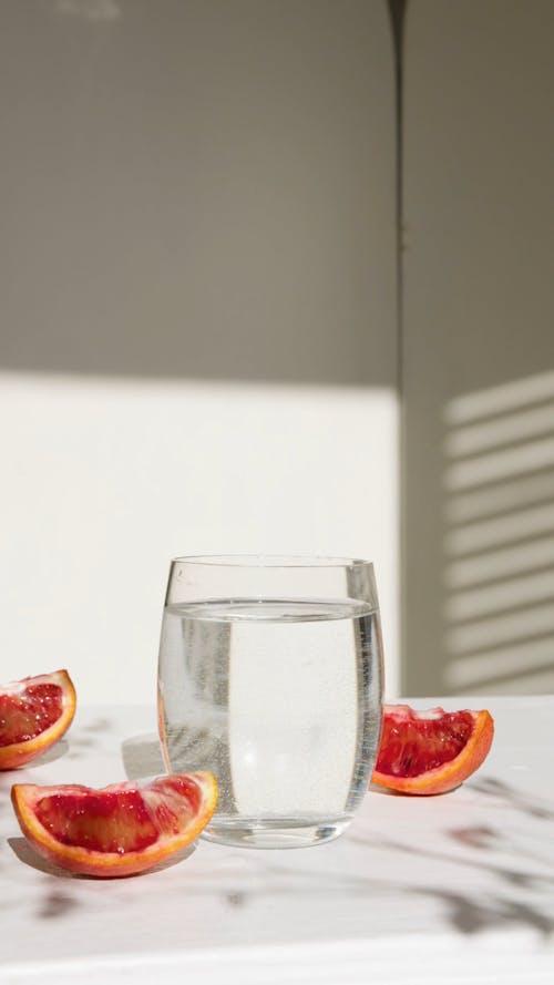 Sliced Grapefruits on a Flat Surface