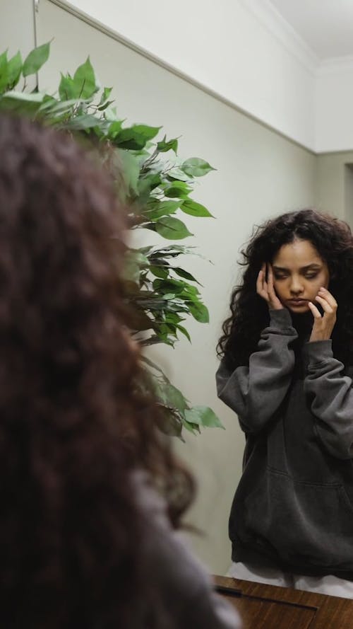 Woman Looking at the Mirror