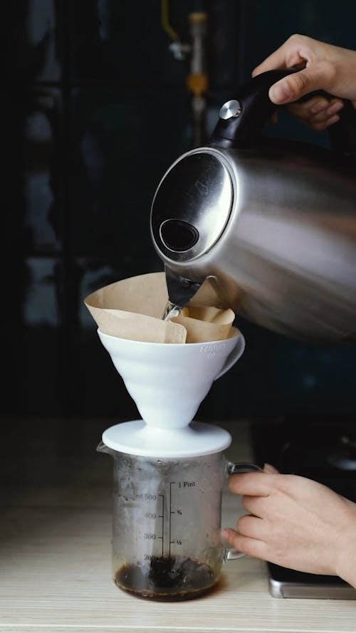 A Person Making A Pour Over Coffee