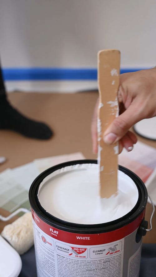 A Person Mixing the Paint