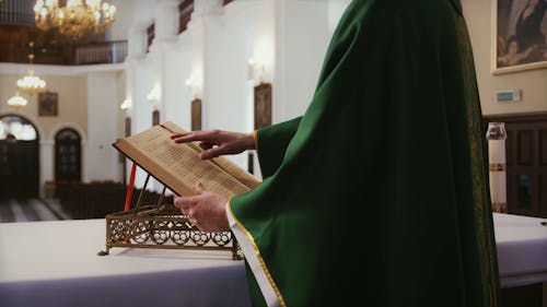 A Priest Reading a Bible