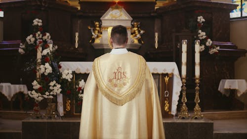 A Priest Doing a Sign of the Cross