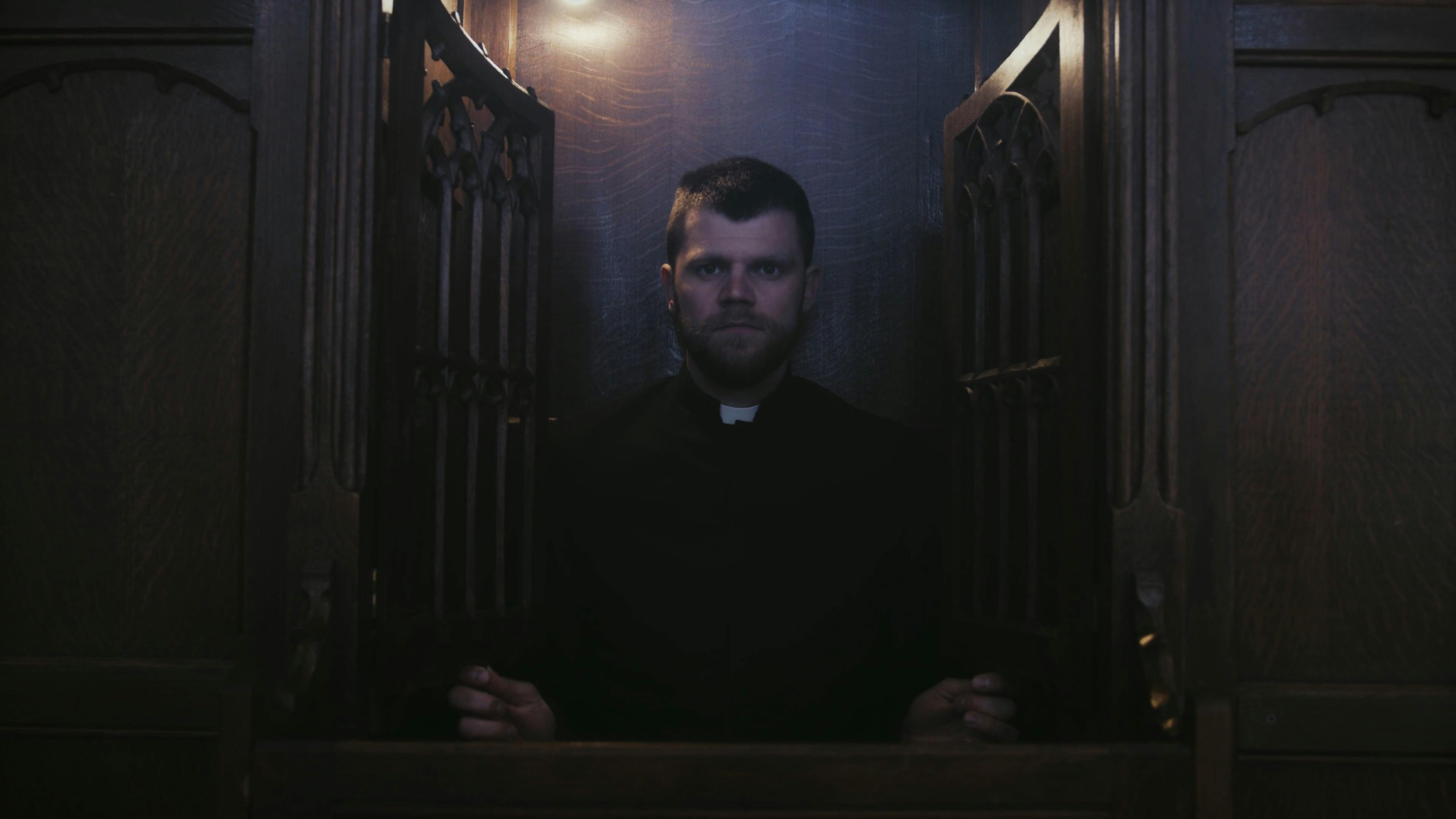 A Priest Inside A Confessional Booth · Free Stock Video