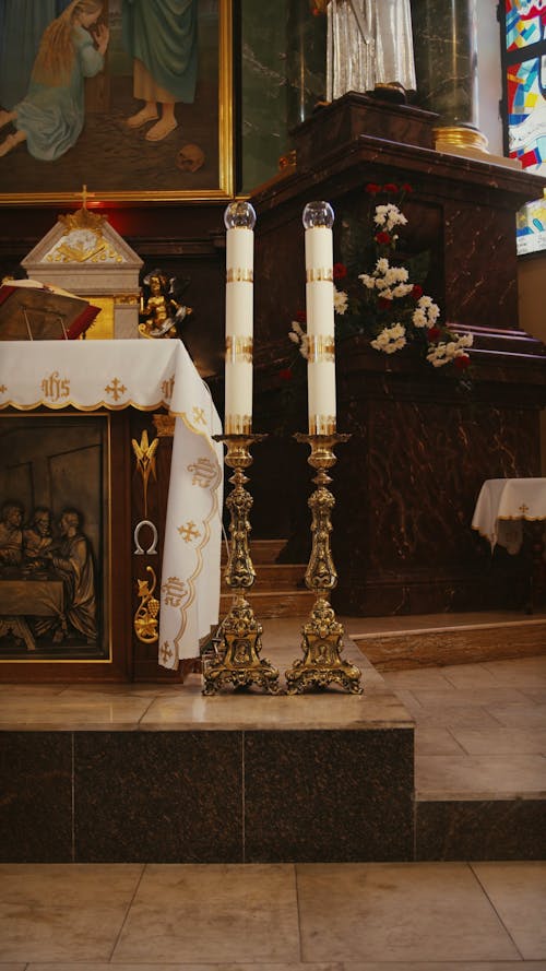 A Nun Lighting the Candles by the Altar