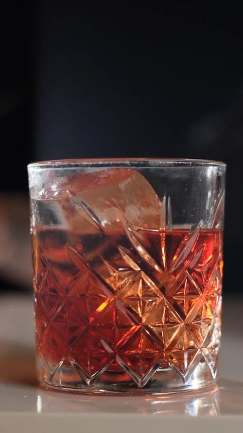 Putting a Dried Orange Slice on a Cocktail Drink